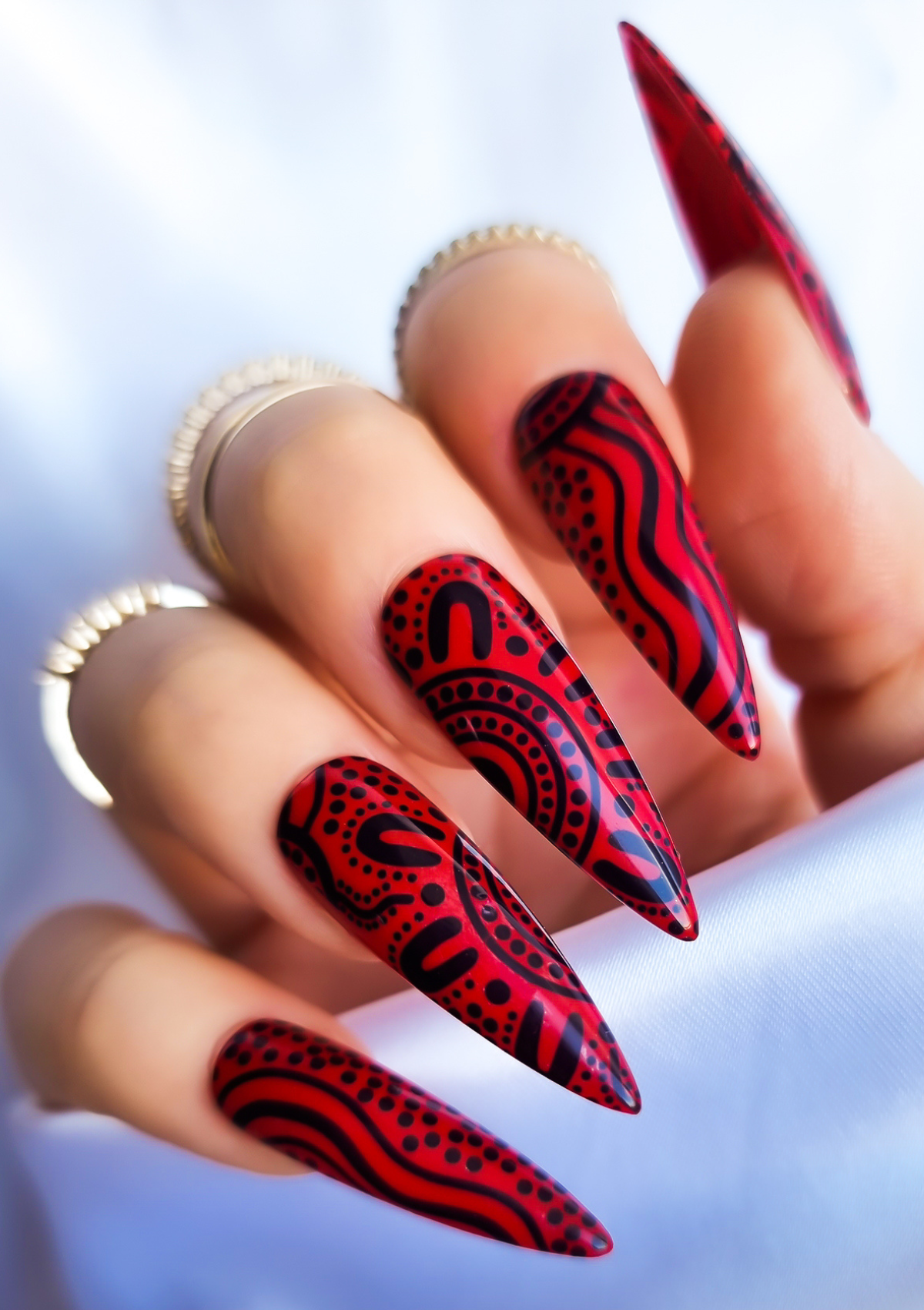 Red nail with black Aboriginal Australian nail art designs