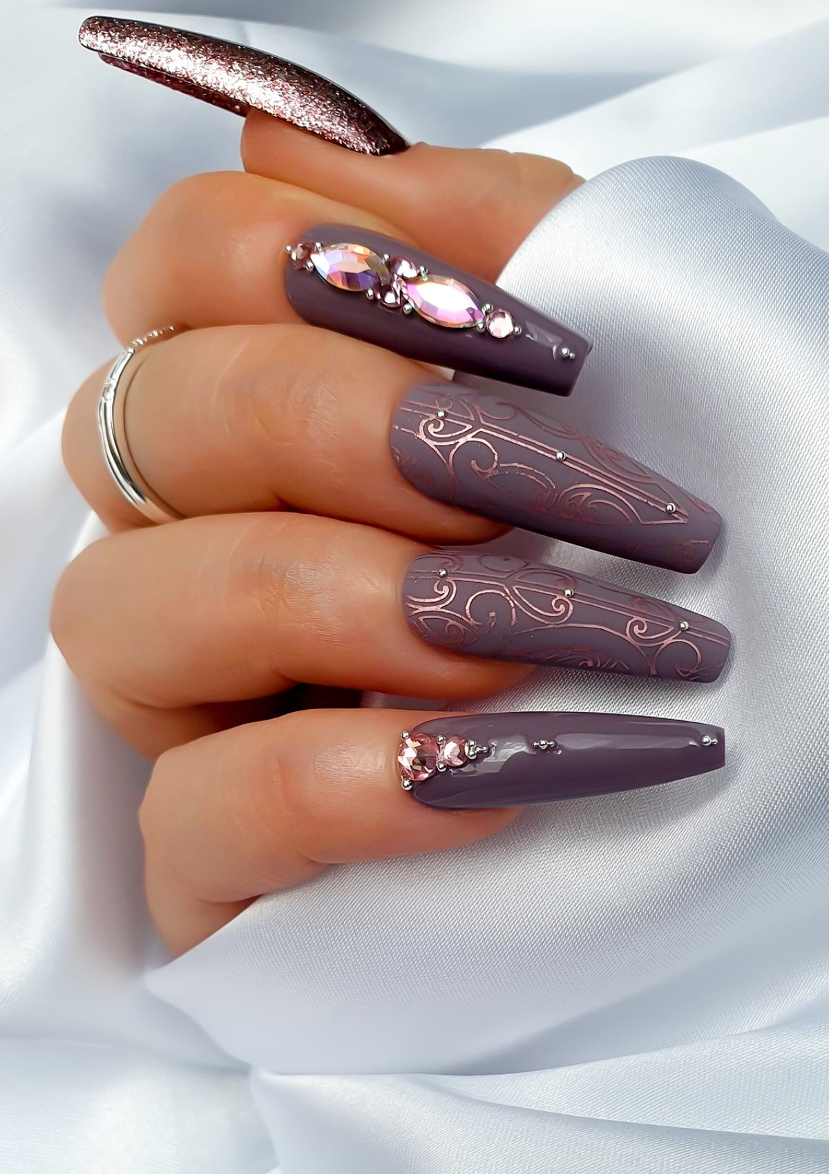 Mauve nails with rose pink Maori Nail Foils  and crystals 