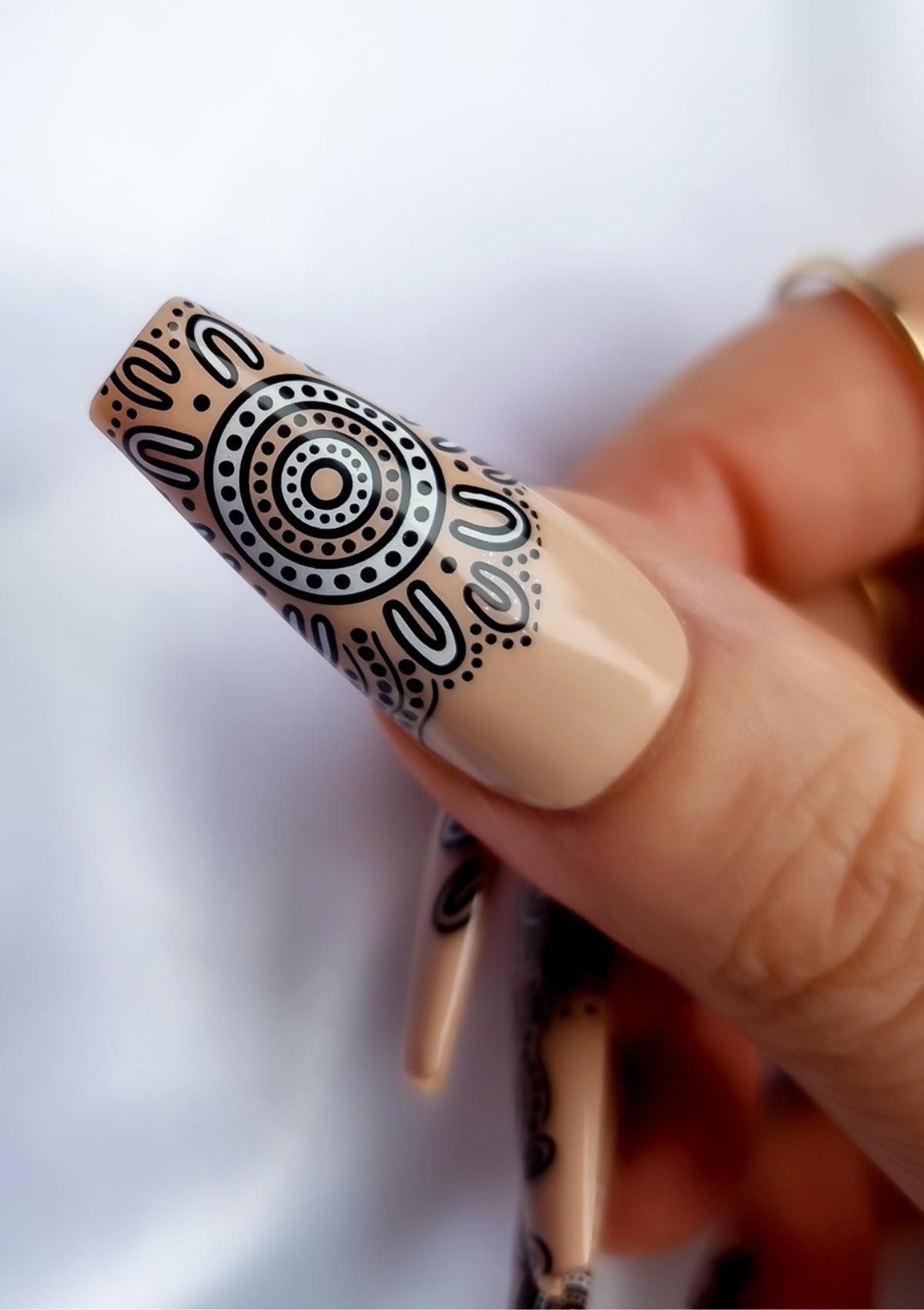 Nude nail with black and white Aboriginal Australian nail art designs